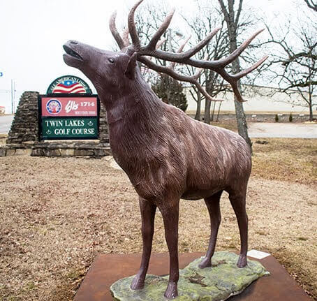 elks lodge sign and elk statue