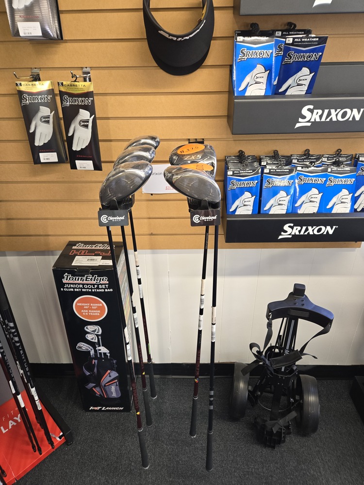 Display of golf drivers and gloves