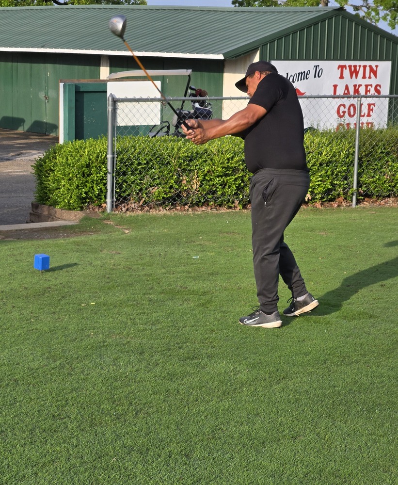 Man swinging golf club