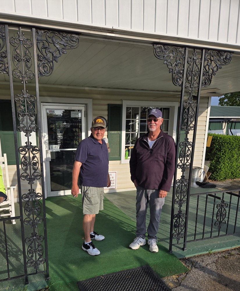 2 men standing on front porch